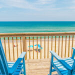 chairs on a deck overlooking the ocean